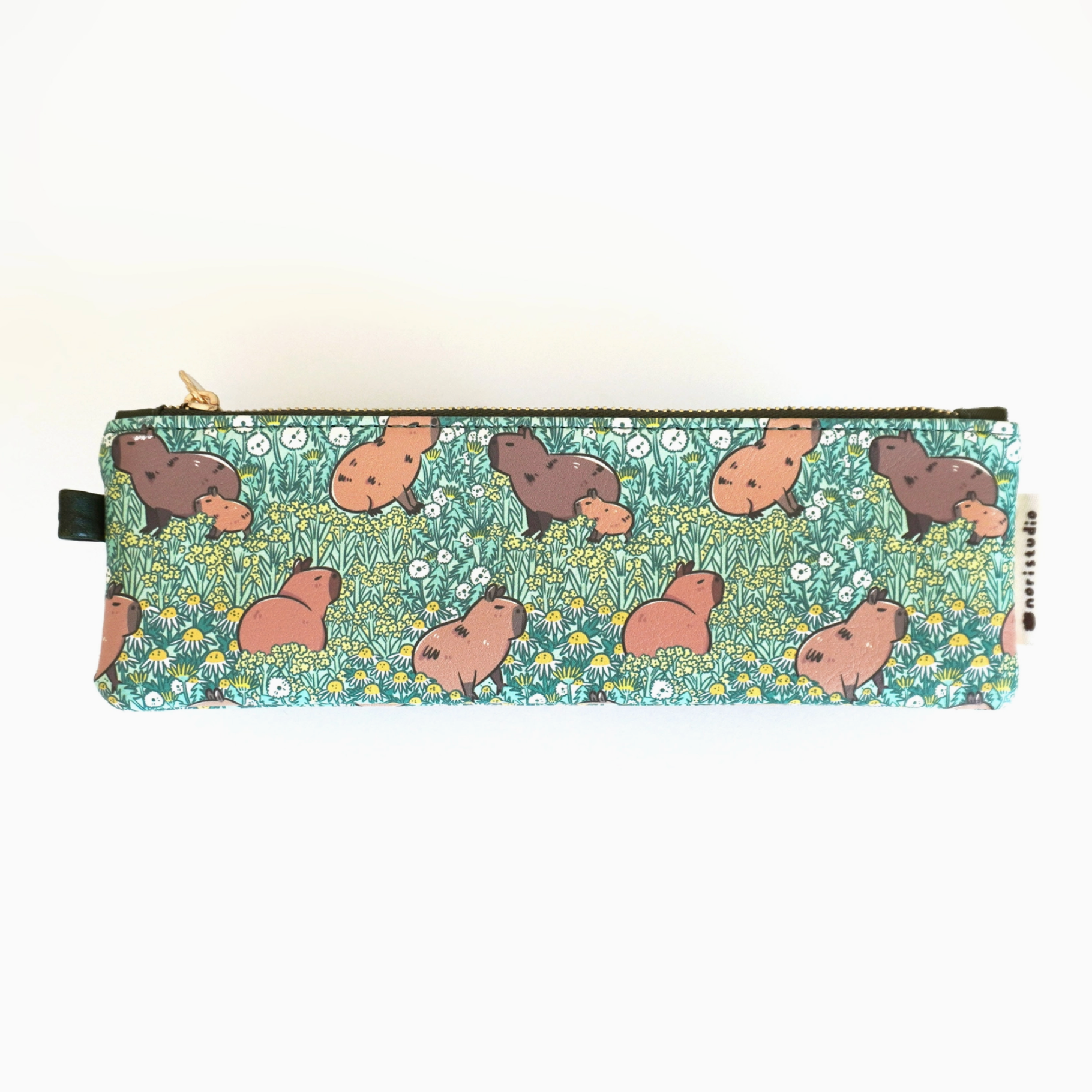 A capybara-themed zipper pencil pouch with a green background and brass zipper.