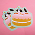 Stickers depicting a whimsical birthday cake with cartoon cats on top, set on a pink background.