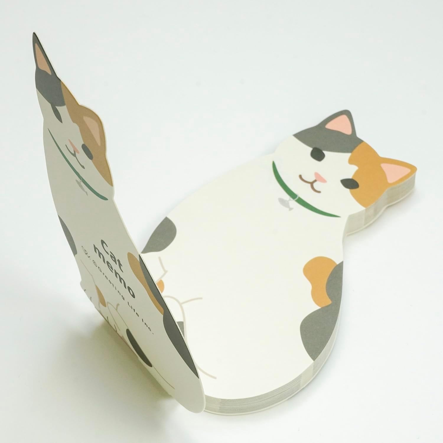 Cat-shaped notepad on a white background