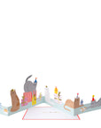 A extended card with cats in various poisitions among presents.