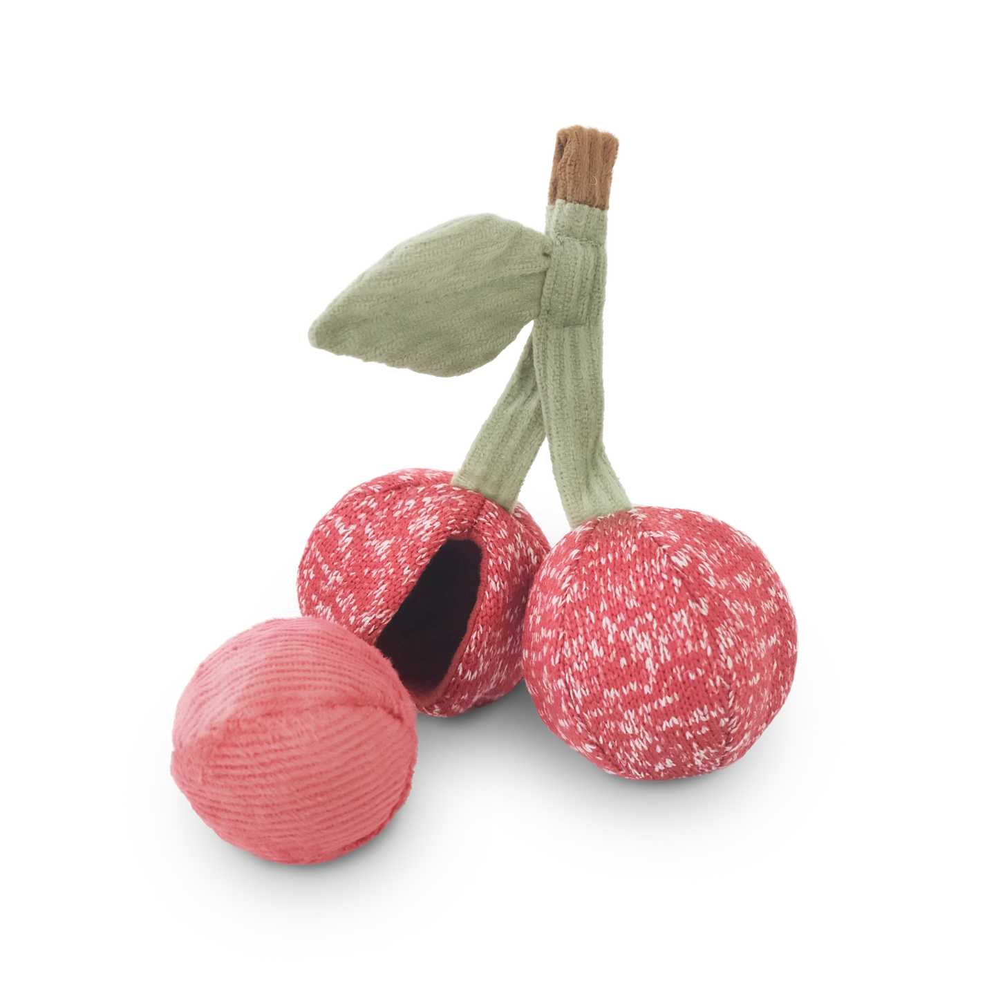 Red fabric cherry dog toy with green stems on a white background