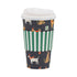 A festive paper coffee cup with a pattern of dogs wearing holiday accessories, such as Santa hats, and Christmas-themed clothing, set against a dark background with green stripes. The cup is equipped with a white plastic lid.