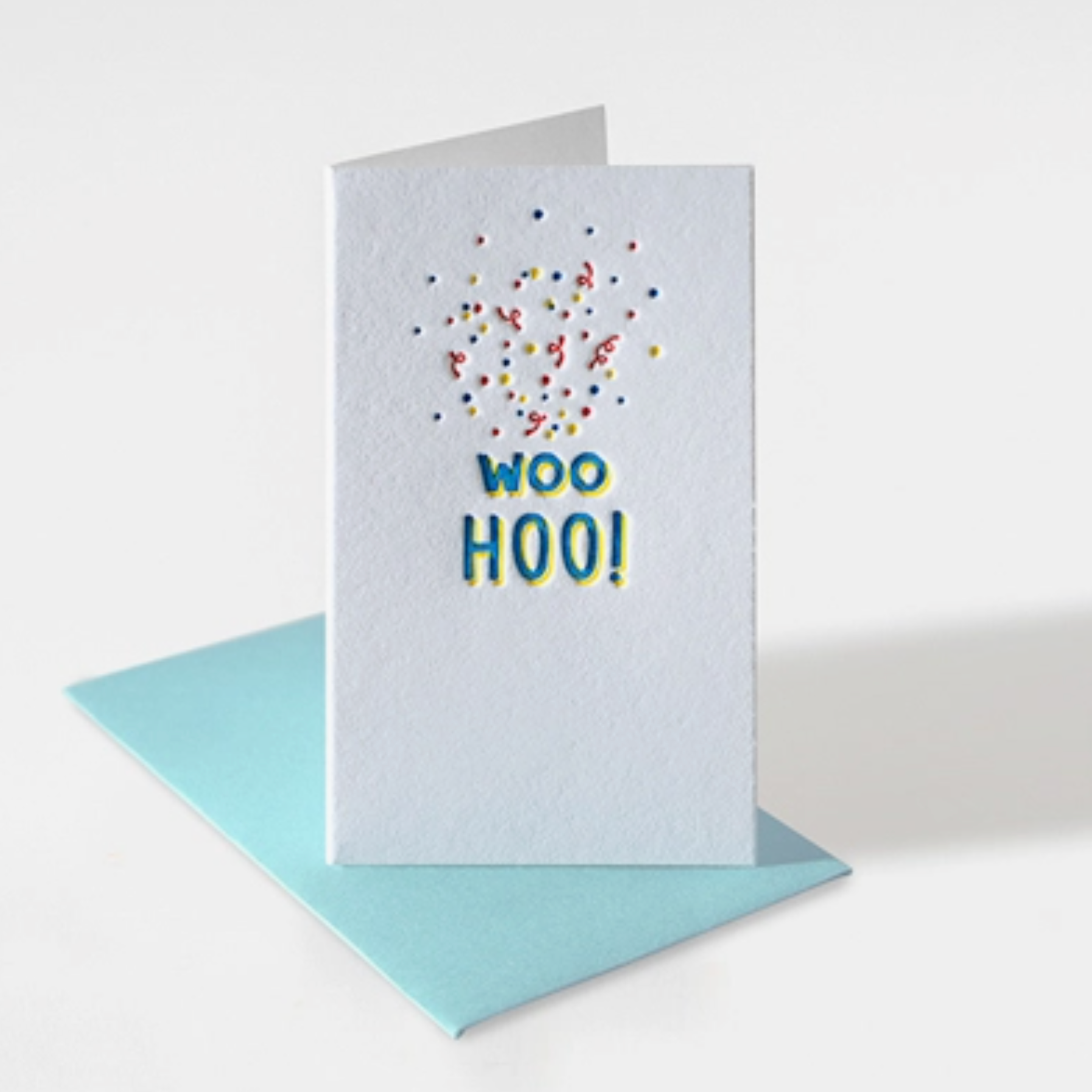 mini white notecard with confetti and text "woohoo!"