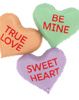 A trio of pastel hearts with red text reading "Be mine" "true love" and "Sweet heart"