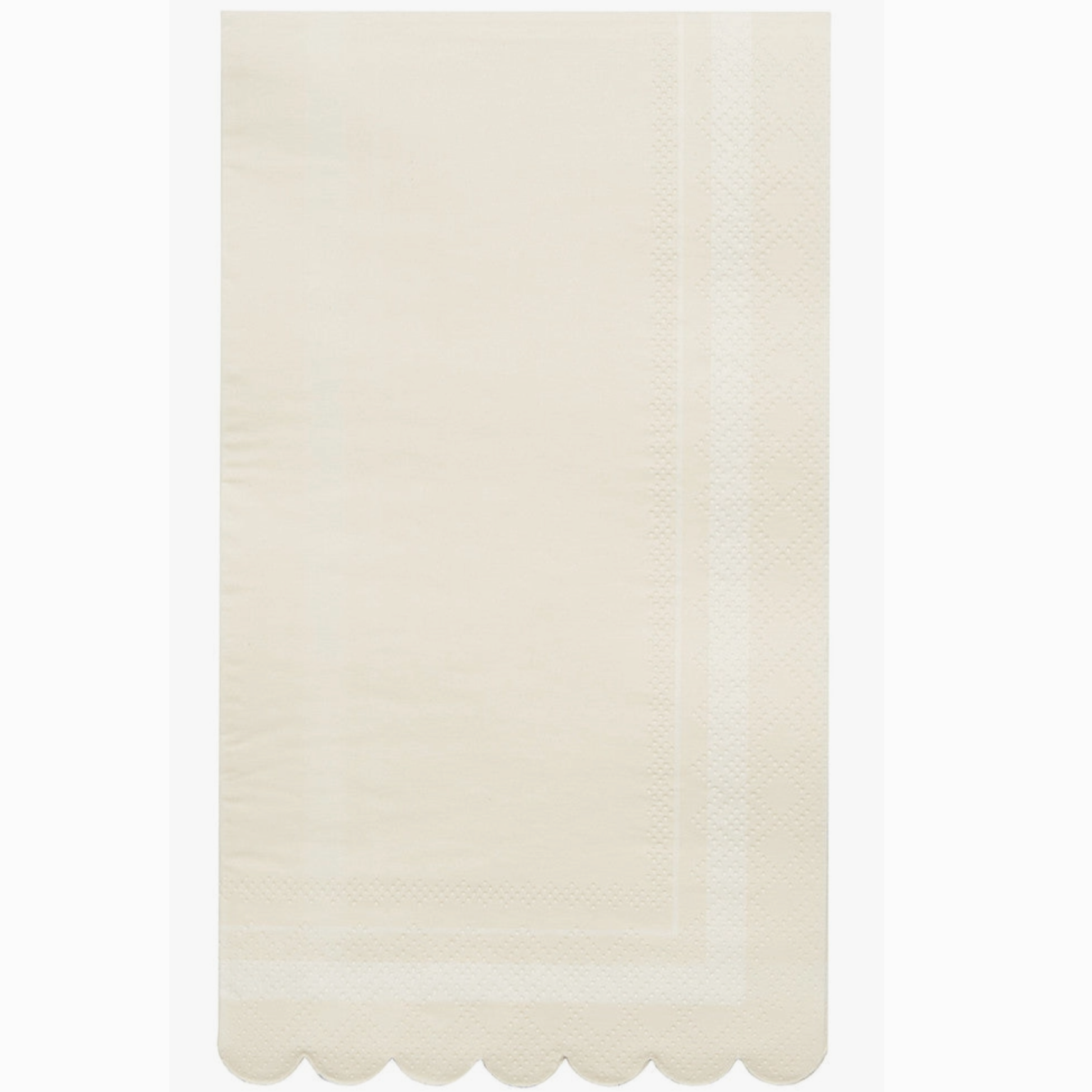 A cream-colored napkin with scalloped edges, presented on a neutral background.