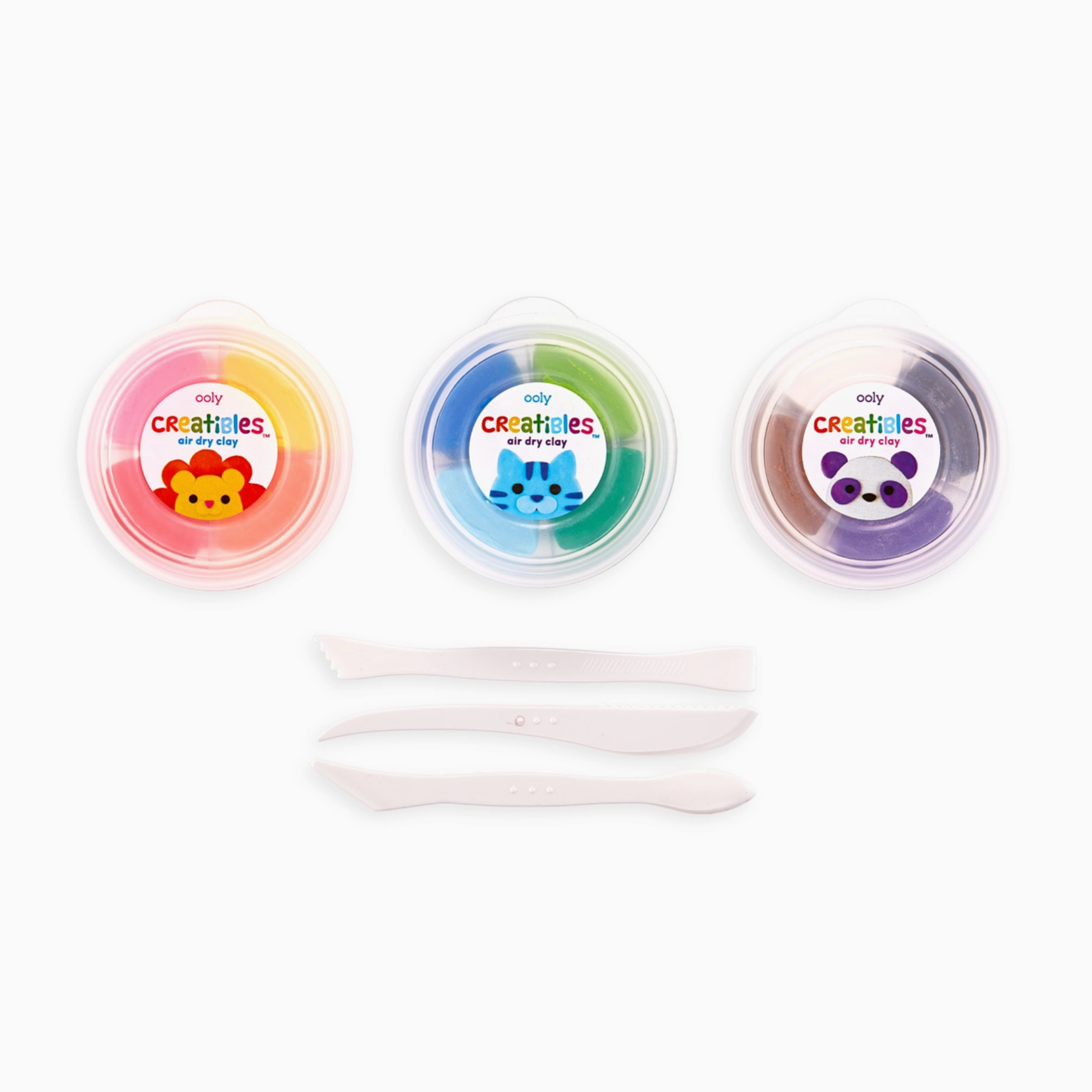 Packaging of Creatibles DIY Air Dry Clay Kit with three colors of clay displayed in round plastic containers and three plastic tools, set against a white background.