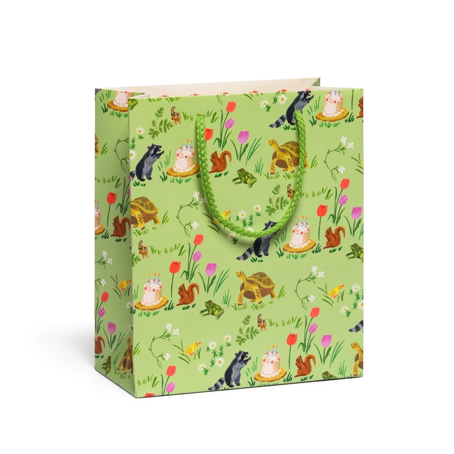 green gift bag featuring woodland critters and birthday cake illustrations