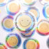 A collection of holographic stickers with the text 'currently overthinking' and a smiley face face on them.