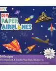 Packaging for DIY Paper Airplanes Activity Kit featuring various colorful paper airplanes and space-themed decorations.