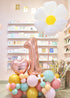 A balloon cloud arrangement featuring a large daisy balloon, a heart-shaped balloon with a name on it, and a number balloon, surrounded by smaller colorful balloons.