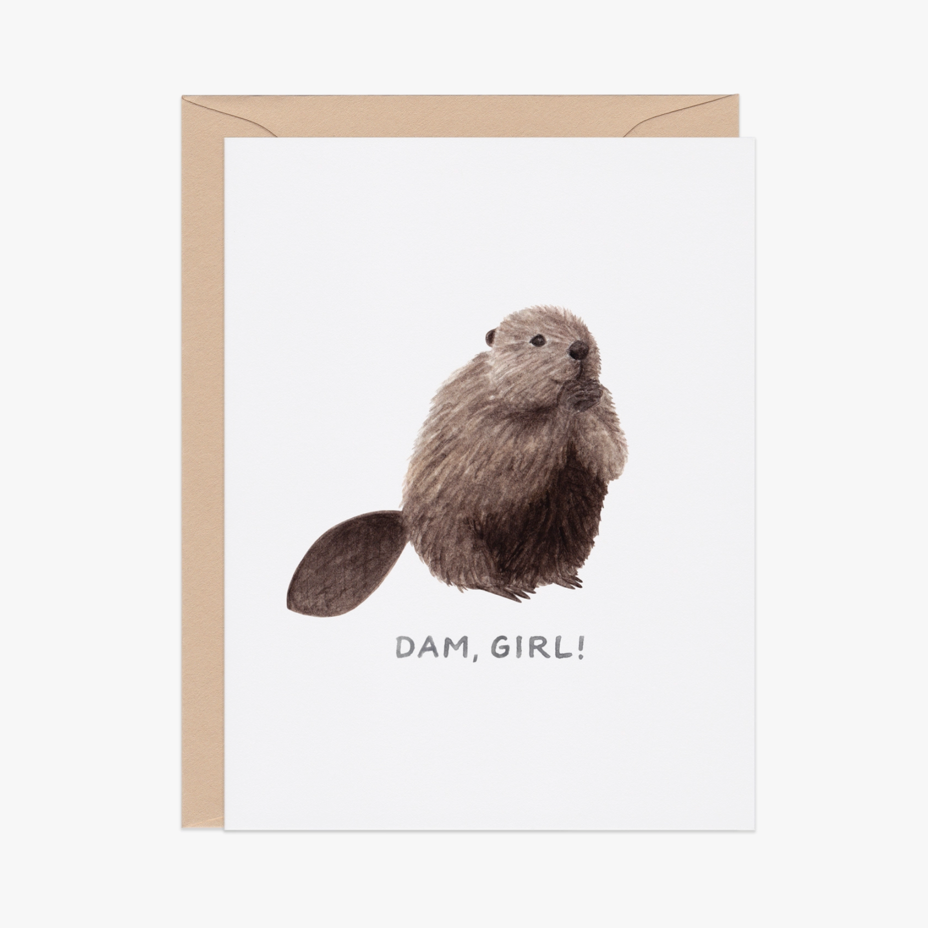 A greeting card with an illustration of a beaver on the front, with the text 'Dam, girl!'