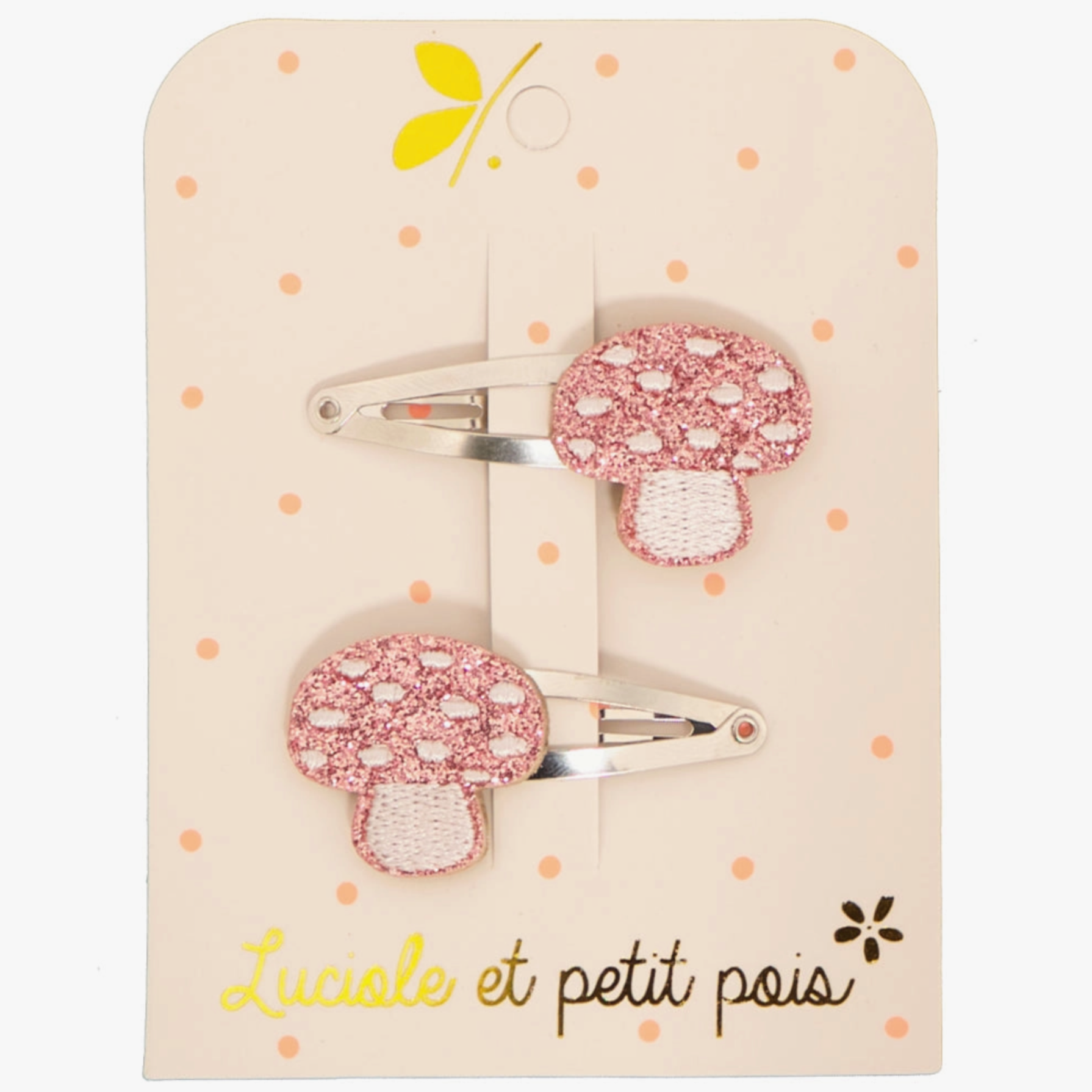 Mushroom glittery hair clips on a polka dotted paper backing