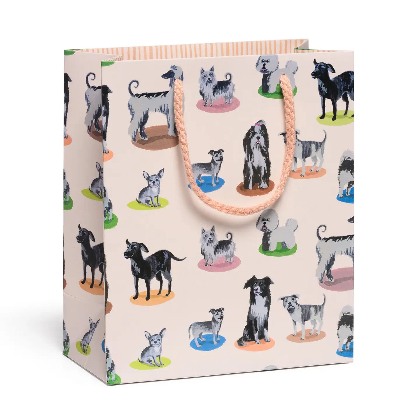 blush colored gift bag with illustration of a variety of dogs sitting on colorful spots