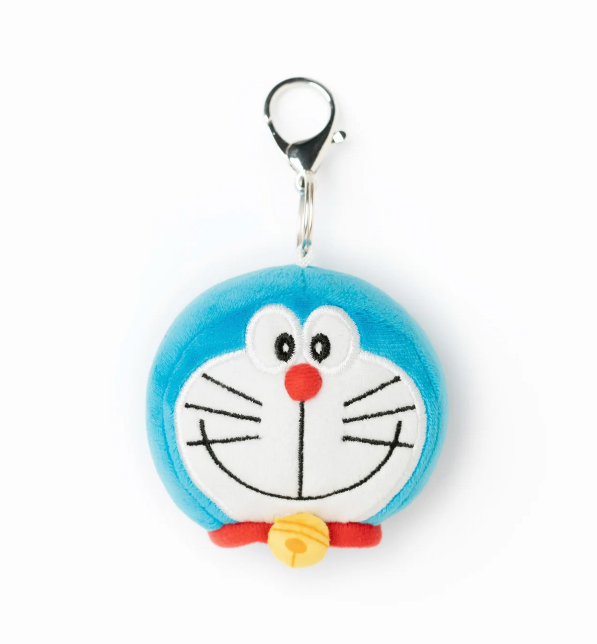 A round plush keychain charm featuring Doraemon's face, with a silver lobster clasp at the top