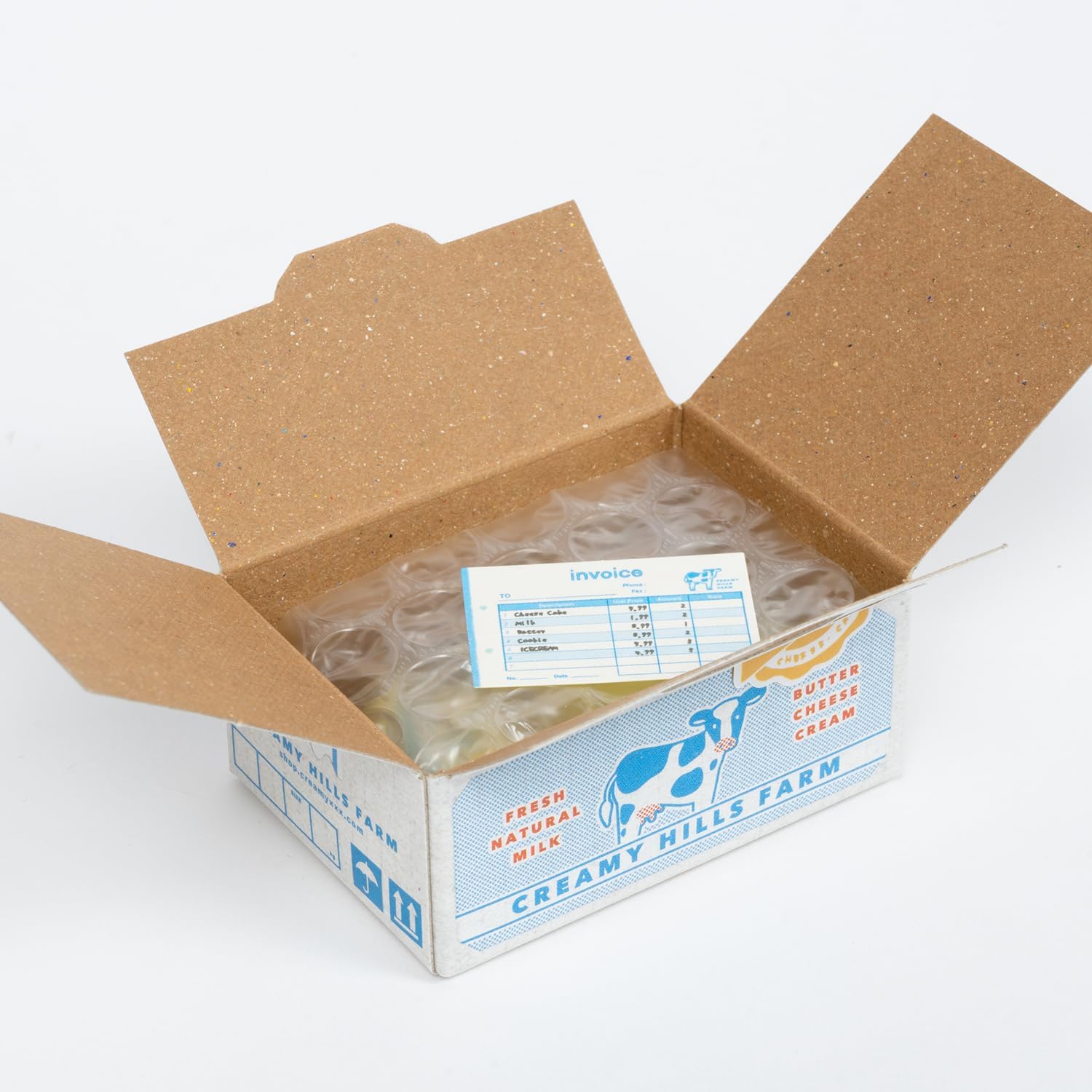 Open cardboard box with a label inside, on a white background