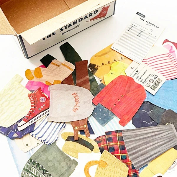 A collection of colorful miniature fabric accessories and clothing piece stickers on white background