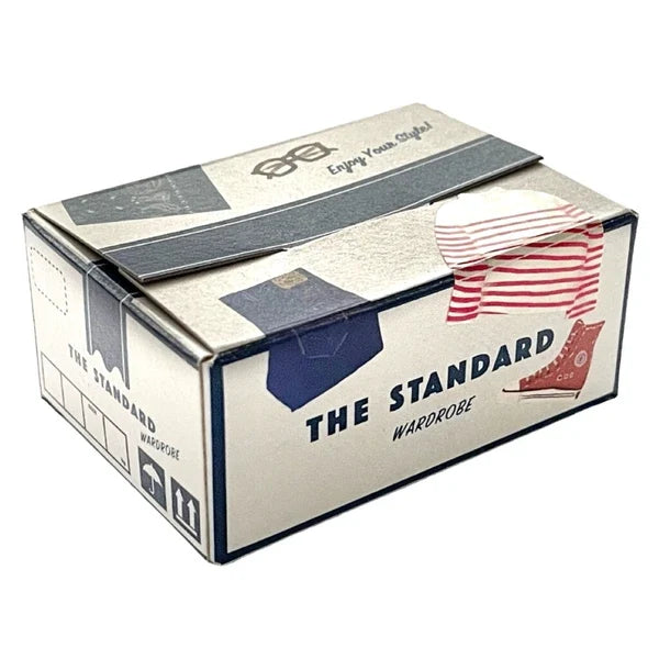 Box with 'The Standard Wardrobe' text and clothing illustrations visible on a white background