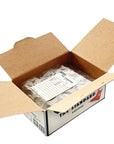 Open cardboard box with a clear plastic bag containing items, branded 'The Standard'.