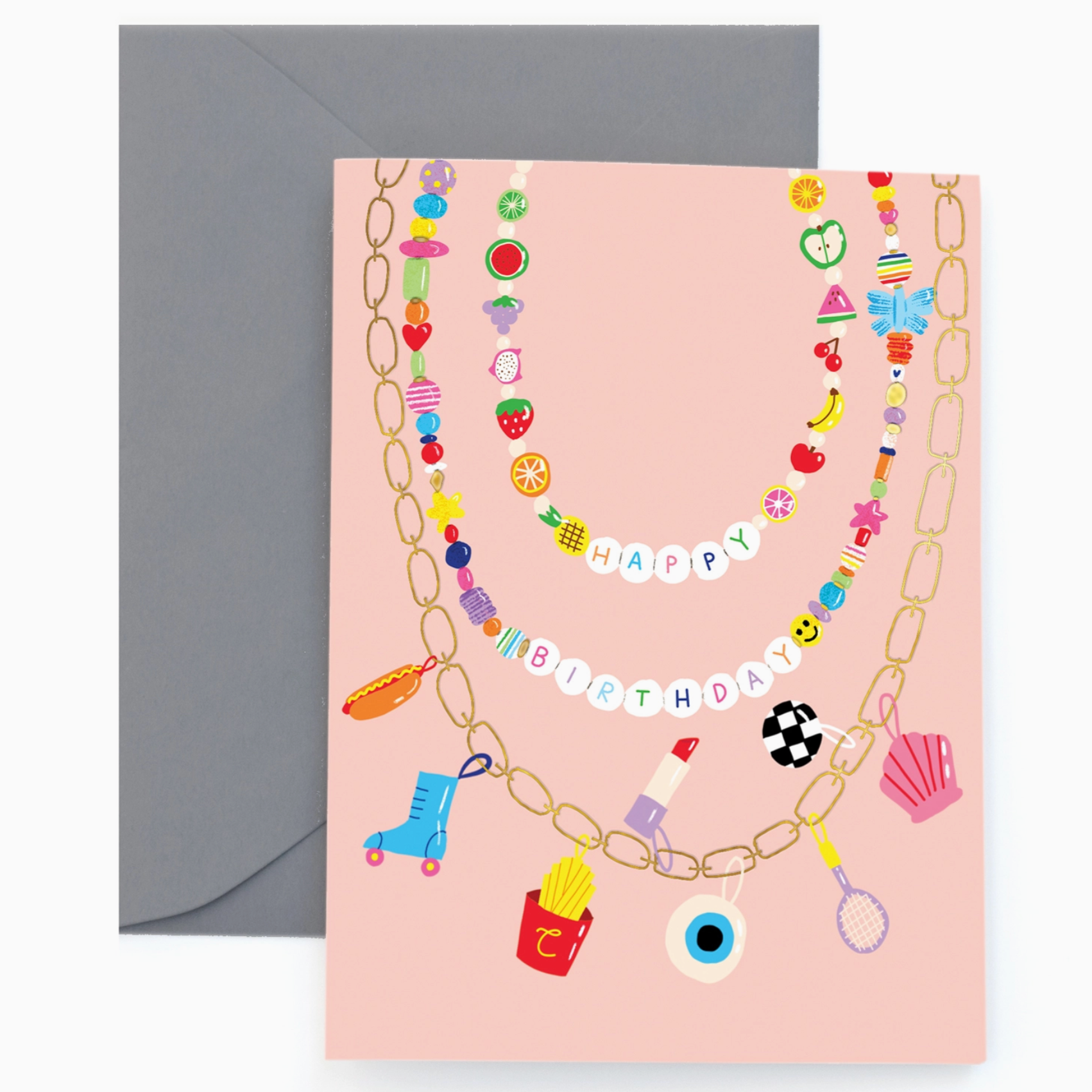 A colorful birthday card with 'Happy Birthday' text decorated with various playful bead-like designs, accompanied by a coordinated envelope, presented on a pink background.