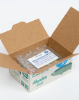 Open cardboard box with bubble wrap and an invoice on a white background