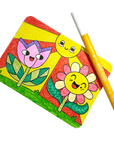 Colorful notebook with cartoon-style flowers and a yellow pen on a white background