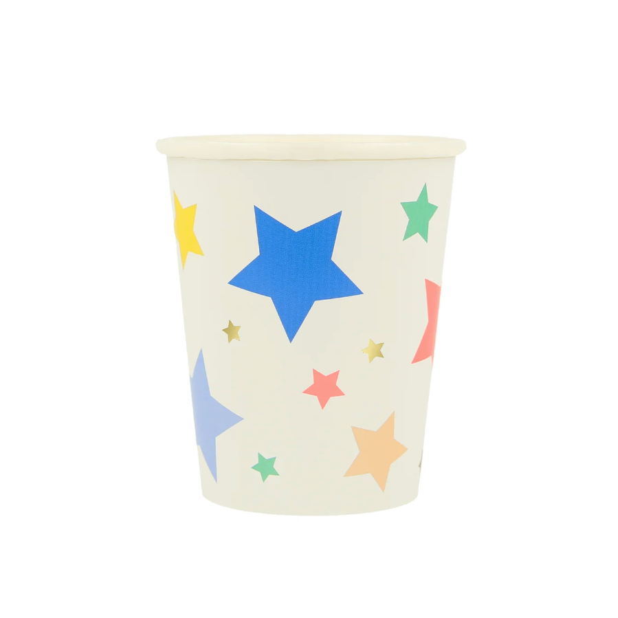 A white paper cup with a multicolored star pattern on it.