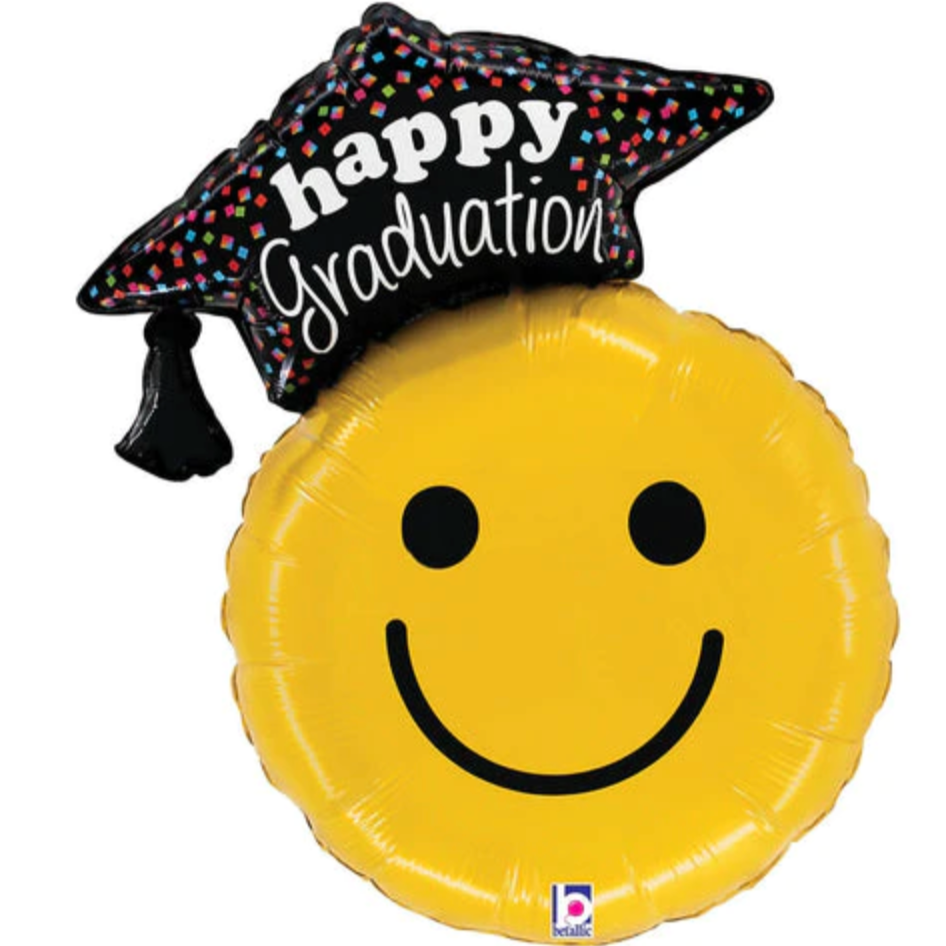 A mylar balloon of a happy face wearing a grad cap that reads "happy graduation"