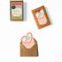 Set of mini birthday cards with envelopes and packaging on a white background