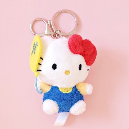 keychain of plush hello kitty holding a balloon