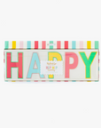 A packaged birthday banner with the words 'HAPPY BIRTHDAY' displayed in colorful letters against a striped background.