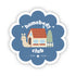A sticker with a blue scalloped edge featuring an illustration of a house, a smiling snail on the left, and the text 'homebody club' with a subtext 'STAY COZY'. The background is white.
