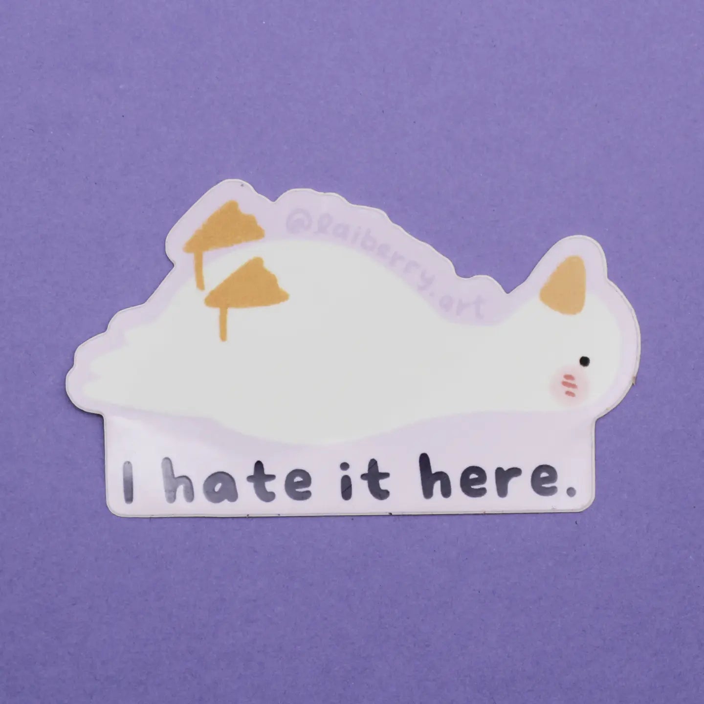 Sticker of goose lying down with text "I hate it here." and purple background