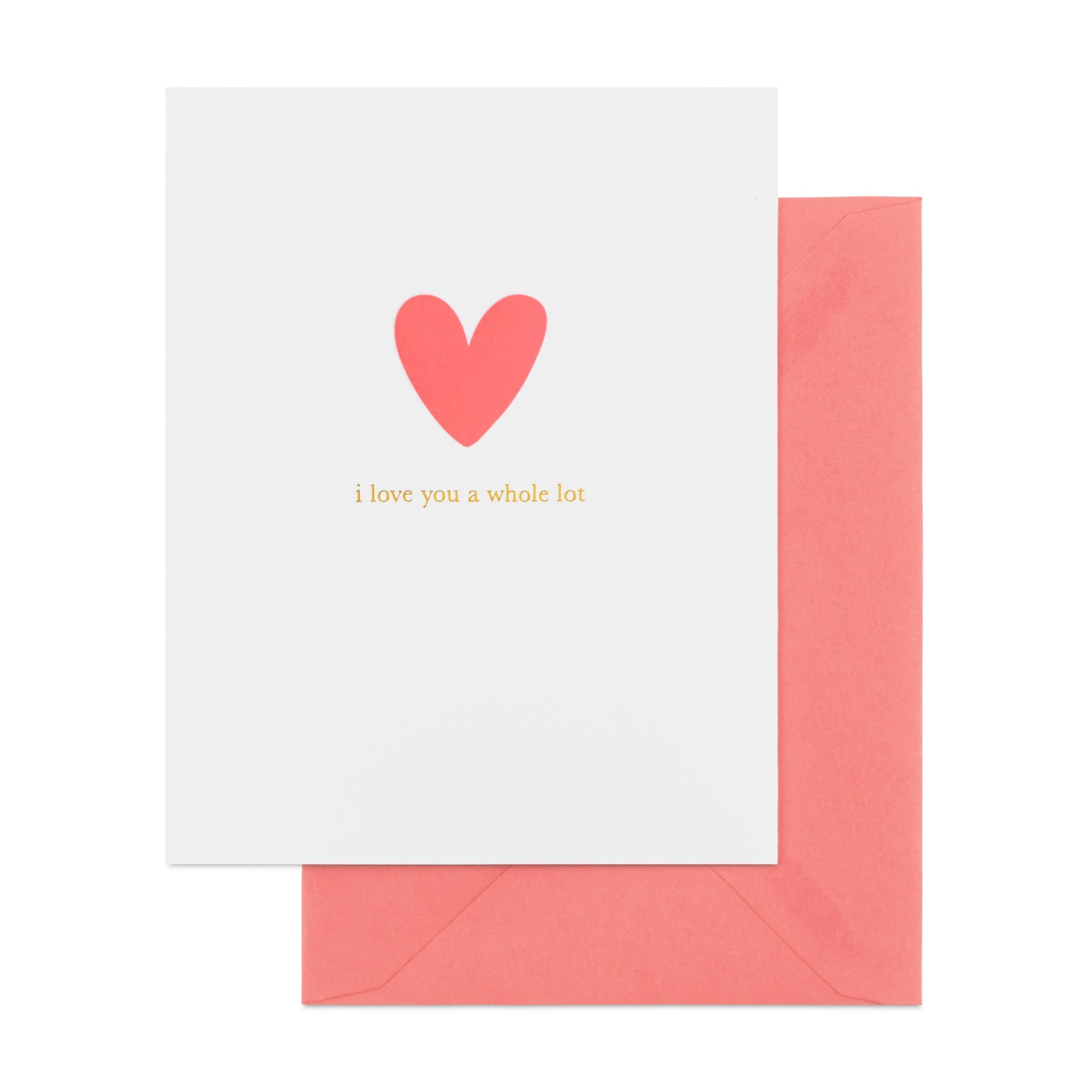 A greeting card with a red heart and the phrase 'I love you a whole lot' printed above it, accompanied by a neon pink envelope.
