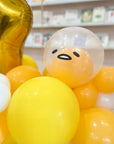 close up of a balloon resembling gudetama