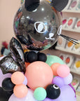 Close up view of the balloons with a personalized name on the halloween bat balloon