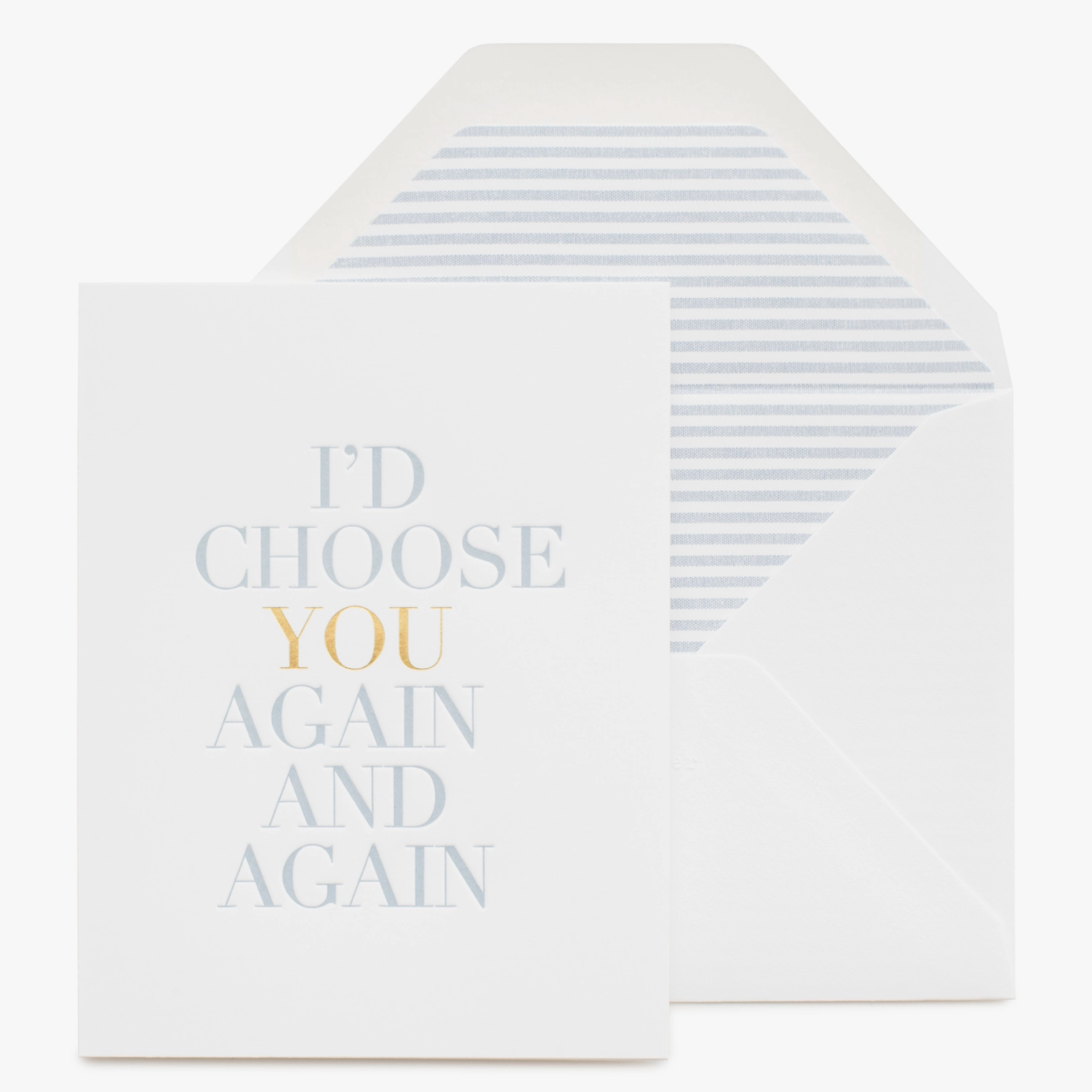 A greeting card with the text 'I'd Choose You Again and Again' printed in blue foil on a white background, accompanied by a matching envelope.