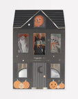 Halloween themed cupake toppers packaged inside a black house box. Paper toppers include two ghost, pumpkins, witch, and skeleton 