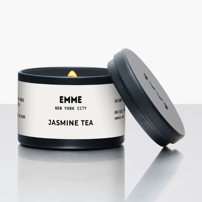 Emme New York City jasmine tea candle tin with lid off on a white background