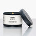 Emme New York City jasmine tea candle tin with lid off on a white background