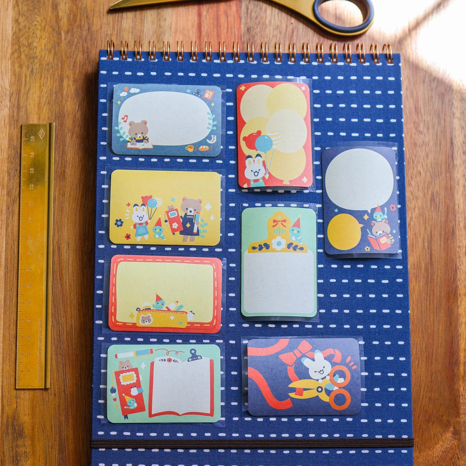 Notebook with colorful sticky notes on a wooden surface
