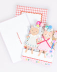 Card with cat illustrations and decorative elements on a white background