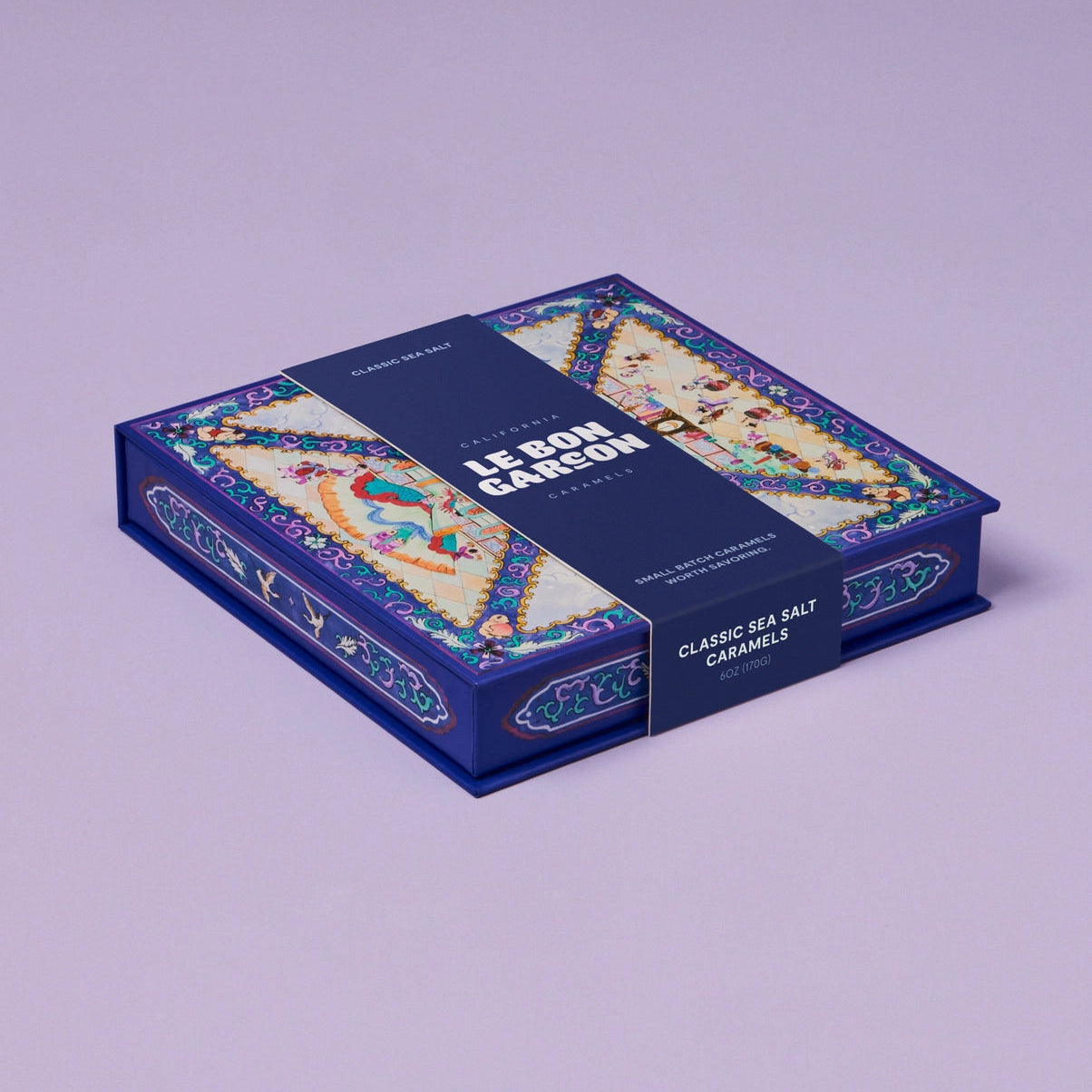 Candy box with colorful design on a light purple background