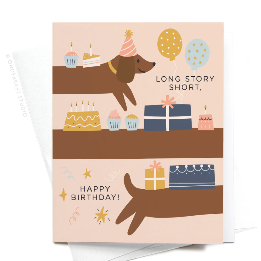 A birthday greeting card with a long dog wearing a party hat and holding cakes and presents on top of him.