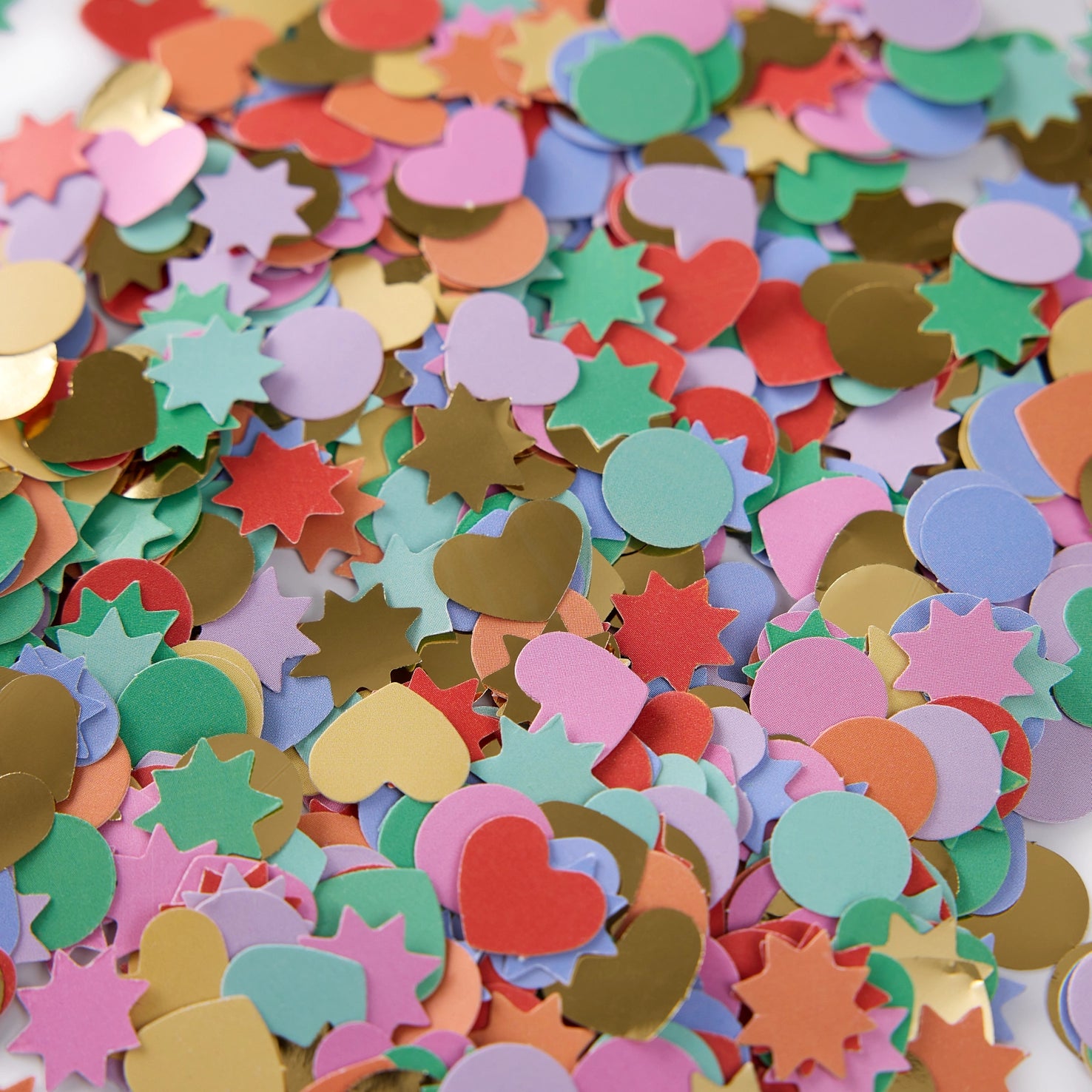 Colorful confetti with heart and star shapes on a white background