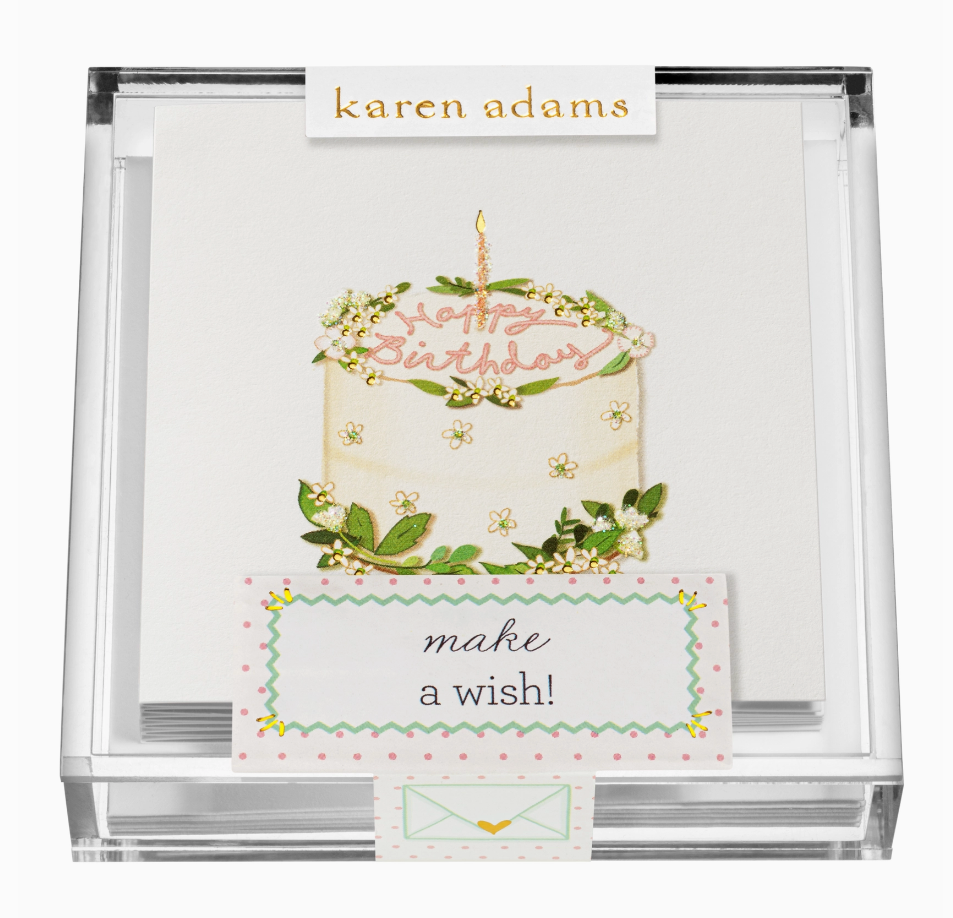 An acrylic box enclosure displaying a hand-glittered birthday card with a cake and the text 'MAKE A WISH!' on the front, along with a blank card and a matching envelope.
