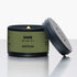 Green candle tin with lid on a white background