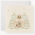 A greeting card with a winter scene that includes a house with snow on its roof, trees, and a reindeer. The card is blank and has a beige background.