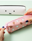 pink zipper long pouch with miffy and boris character printed on. Another white pouch of miffy's face in the back
