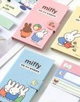Assorted colorful sticky memo notes with illustrations of a character resembling Miffy, including designs with the text 'Miffy' and various cute scenarios.