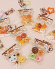 Assorted small packages of colorful treats on a light background